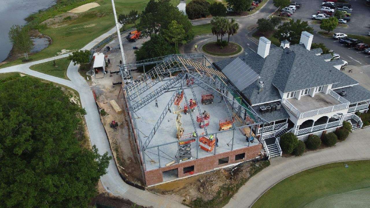 Aerial view of a commercial building addition under construction